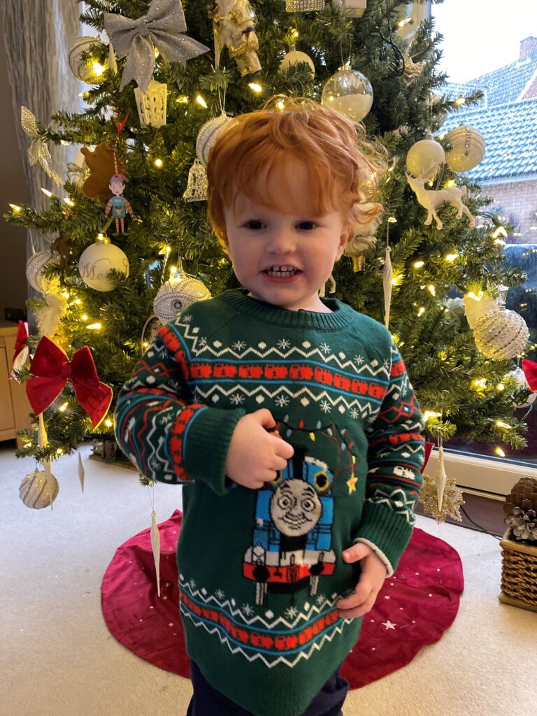 Debenham Ottaway team members child in Christmas jumper