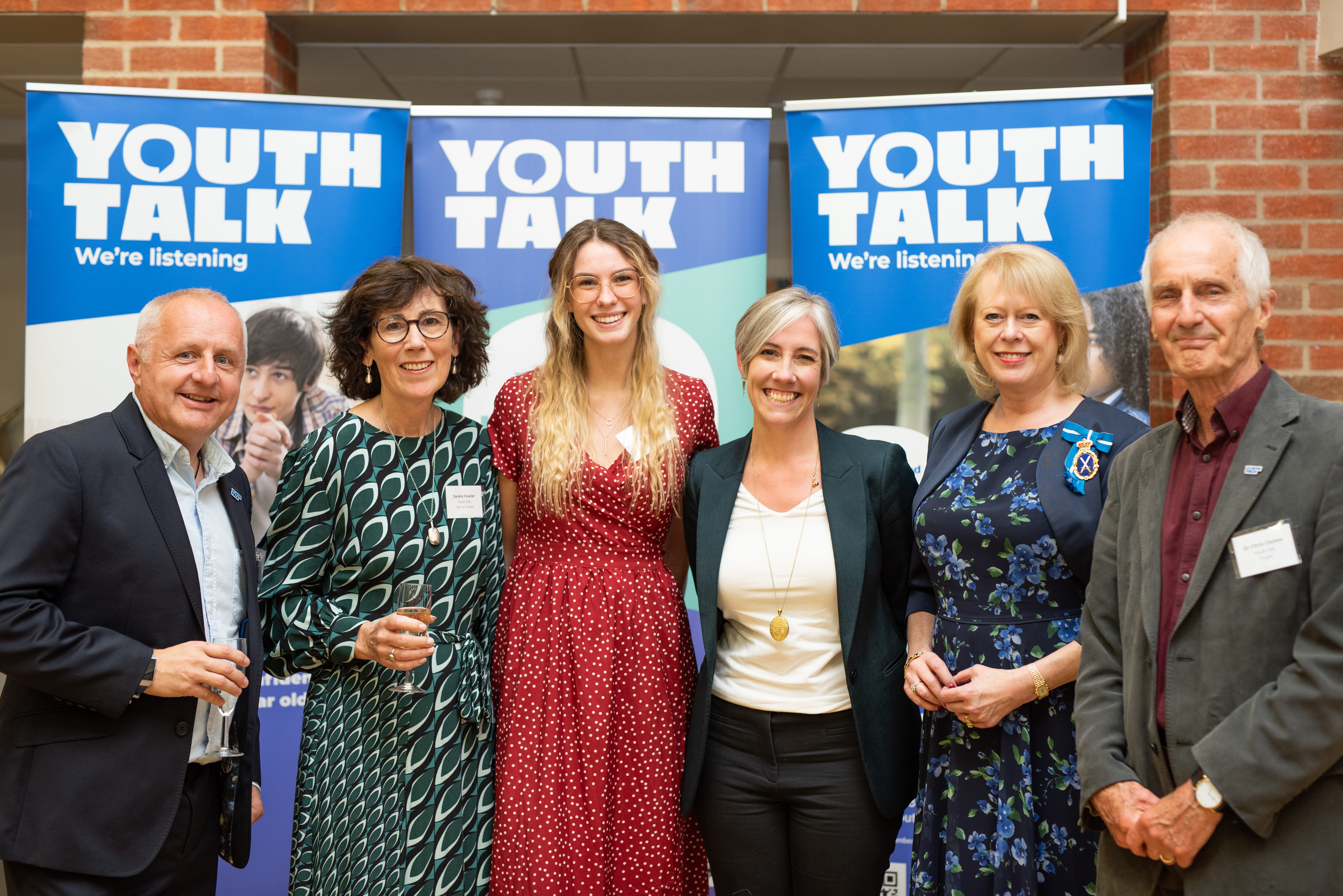 Youth Talk CEO, David Barker, and the chair of our trustees, Jackie Fowler, with local young person and Youth Talk volunteer, Rosie; St Albans MP, Daisy Cooper; the High Sheriff of Hertfordshire, Sally Burton; and Youth Talk trustee, Dr Chris Clulow, at our 25th anniversary celebration