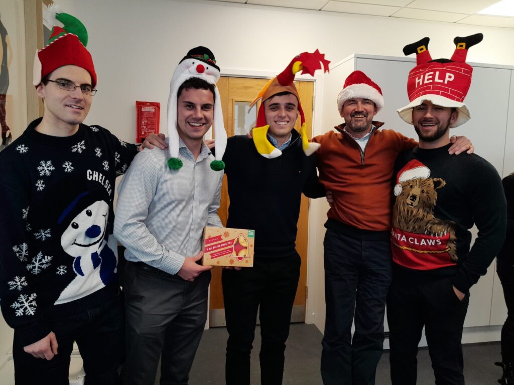 Members of the Lumin team in festive clothing for their Christmas Cracker Day fundraiser in aid of Youth Talk