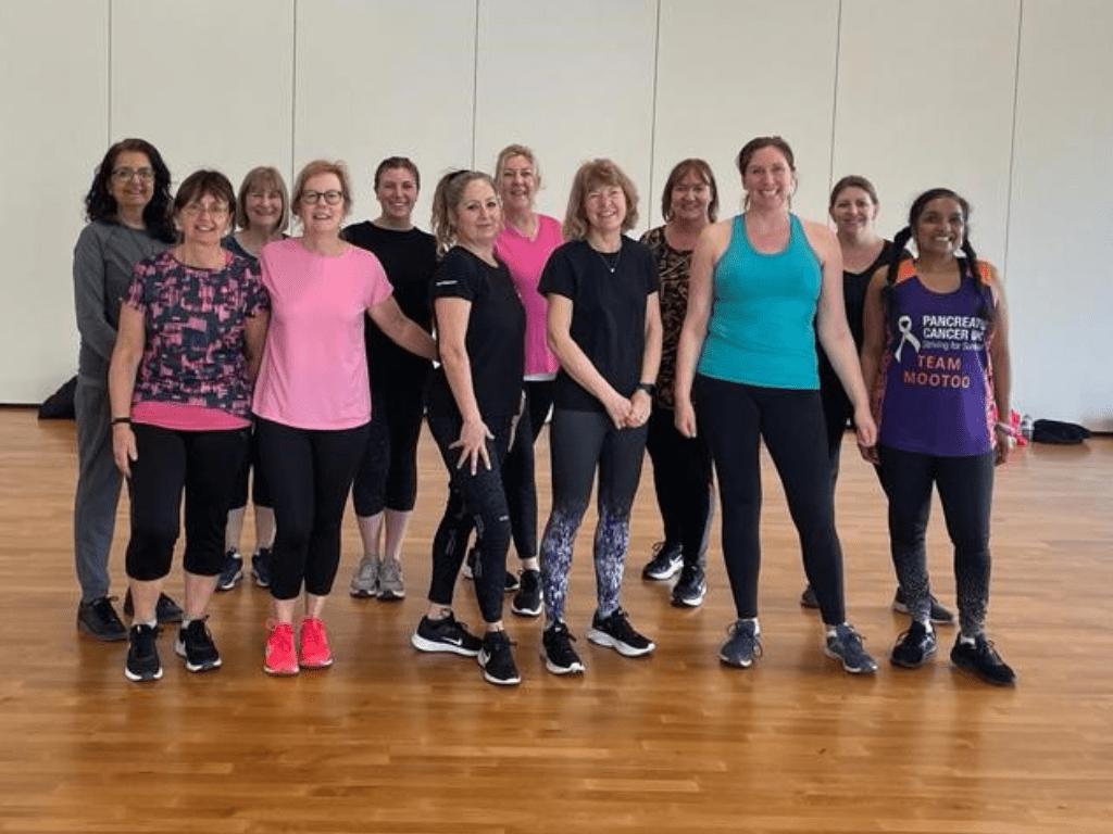 A group of people in fitness clothing at Youth Talk's Dance-a-thon, 2023.