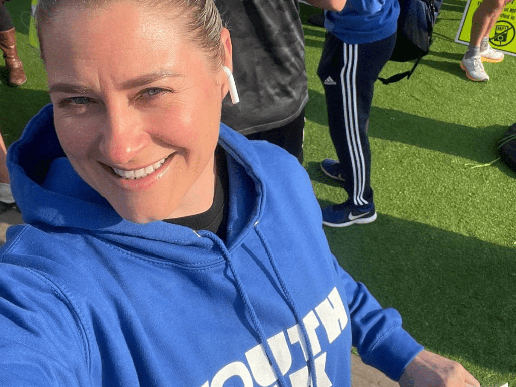 Owner of Buff and Bare beauty clinic, Kristina, in a Youth Talk hoodie at the Hitchin10k 2023.